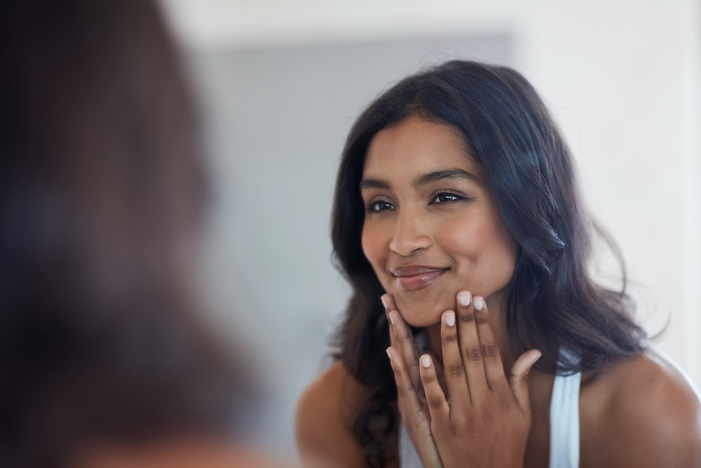 beautiful woman looking in the mirror